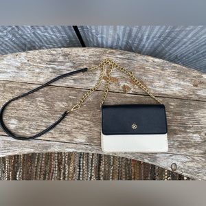 Mini crossbody bag with gold accent chain. Can hold an iPhone 11, with room left
